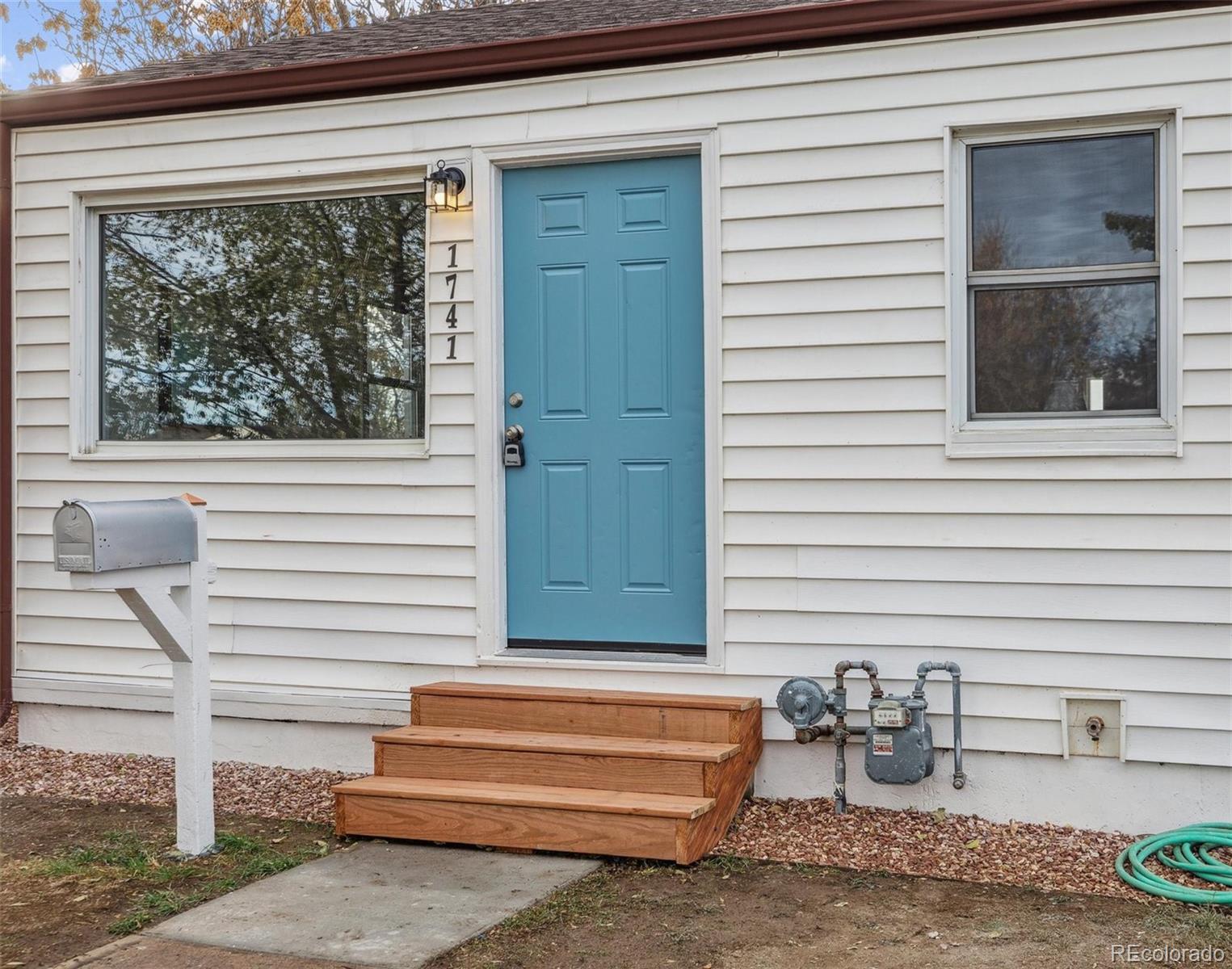 a front view of a house with a outdoor seating