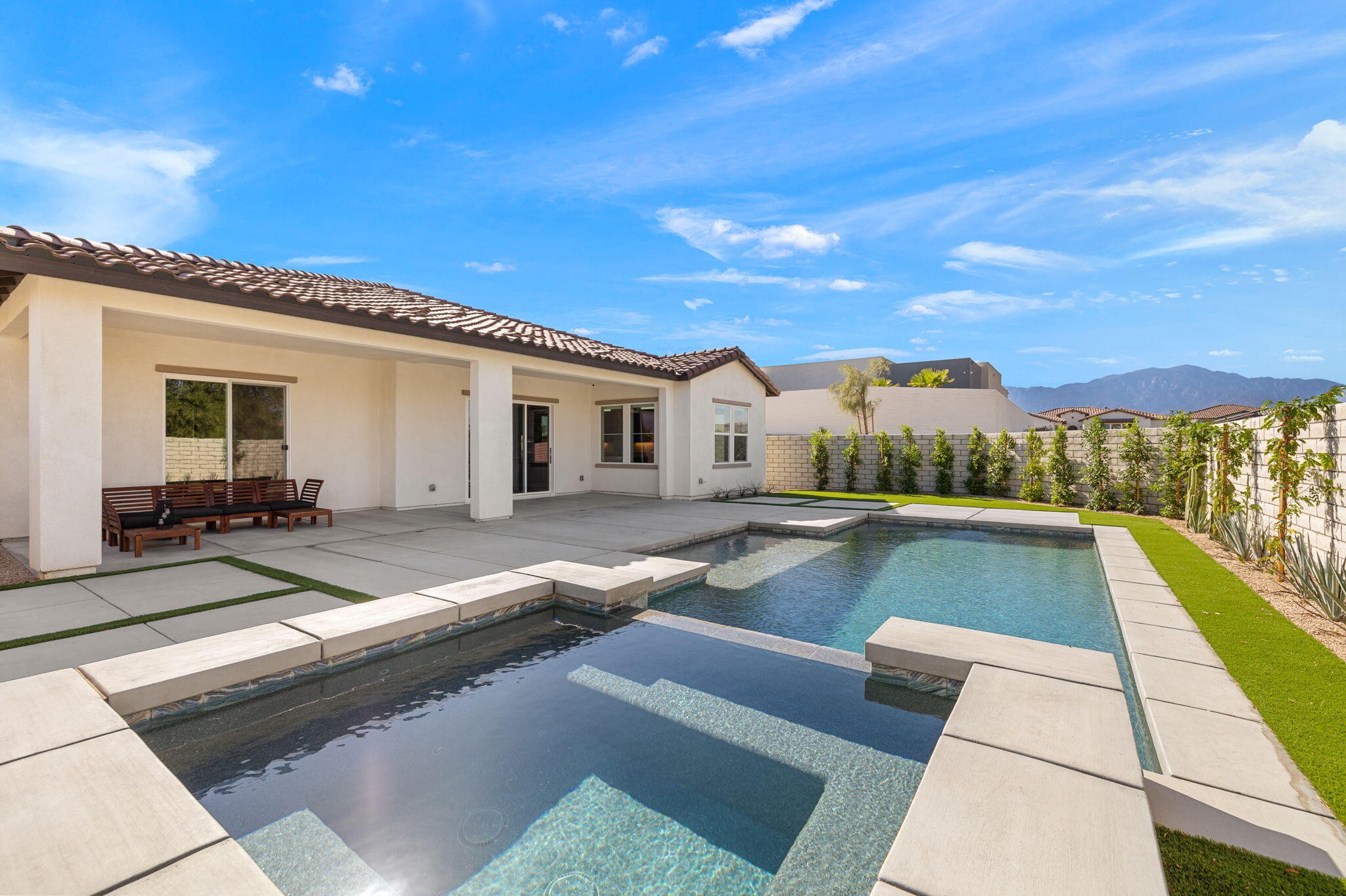 a view of swimming pool with lounge chair