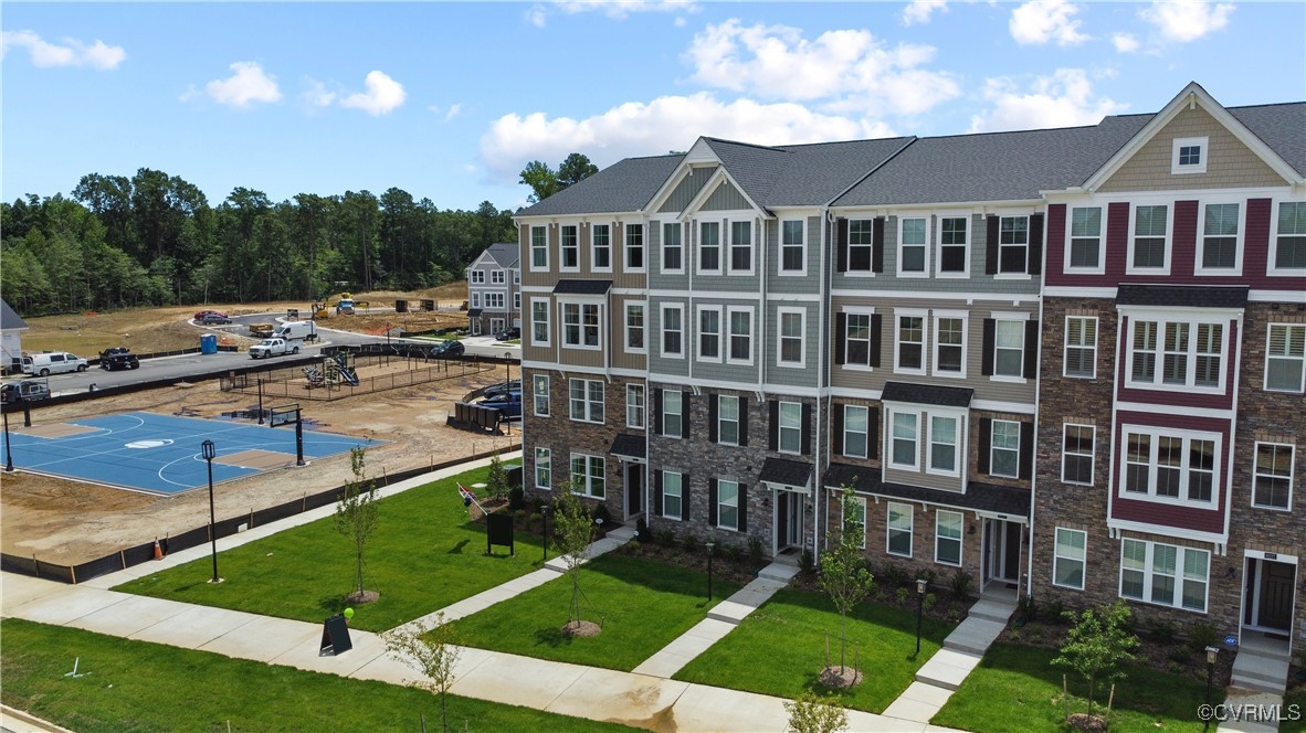 a view of a large building next to a yard