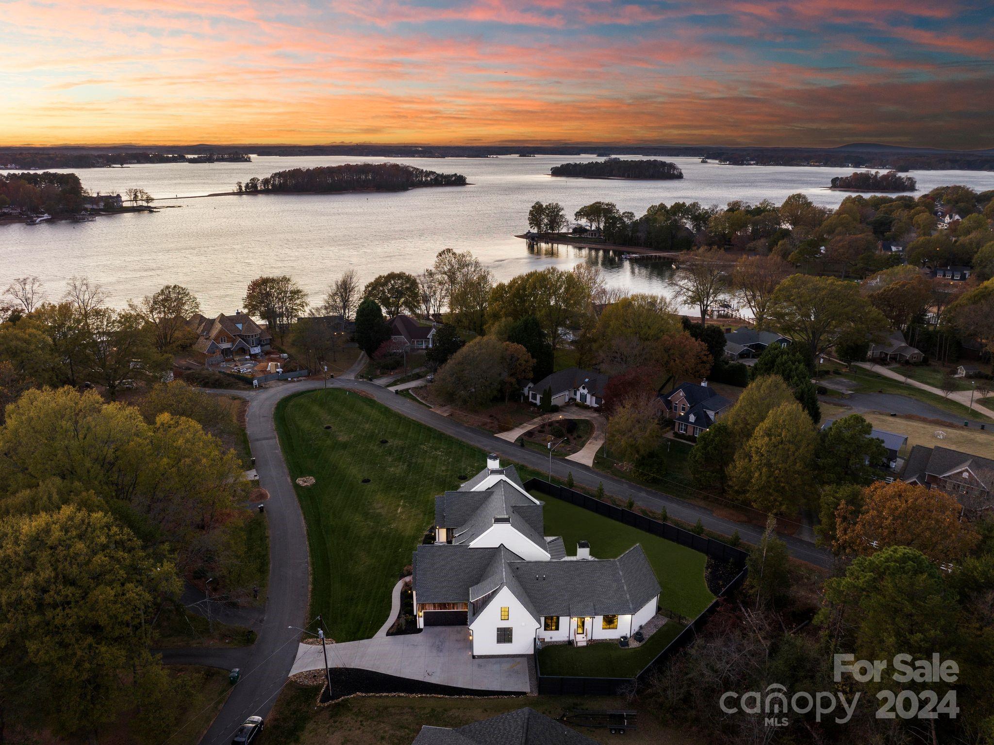 aerial view of a house with a lake view