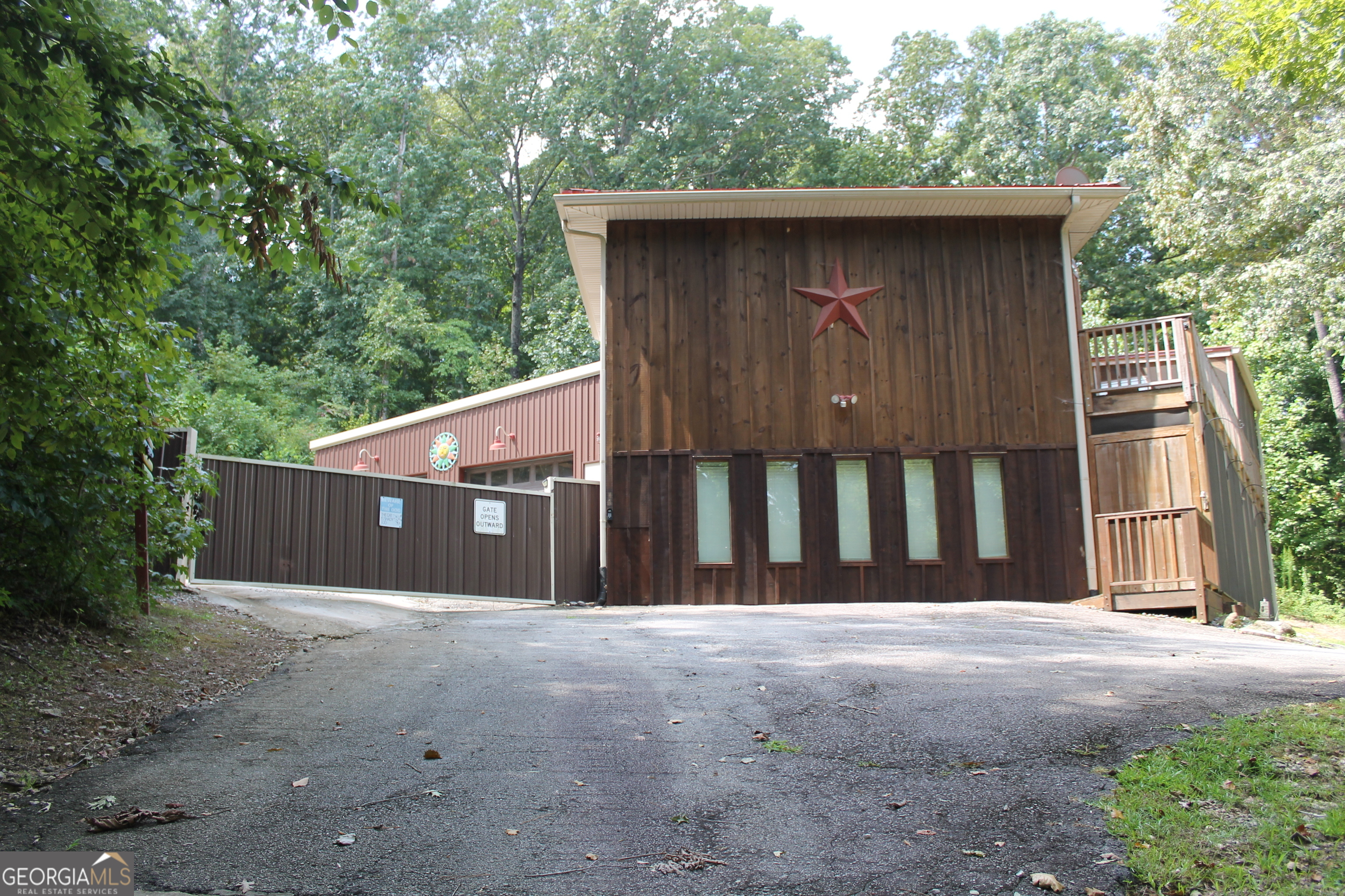 front view of a house with a fence