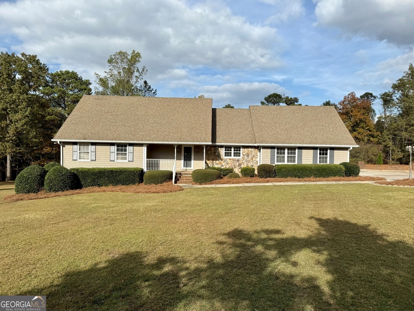 a front view of a house with a yard