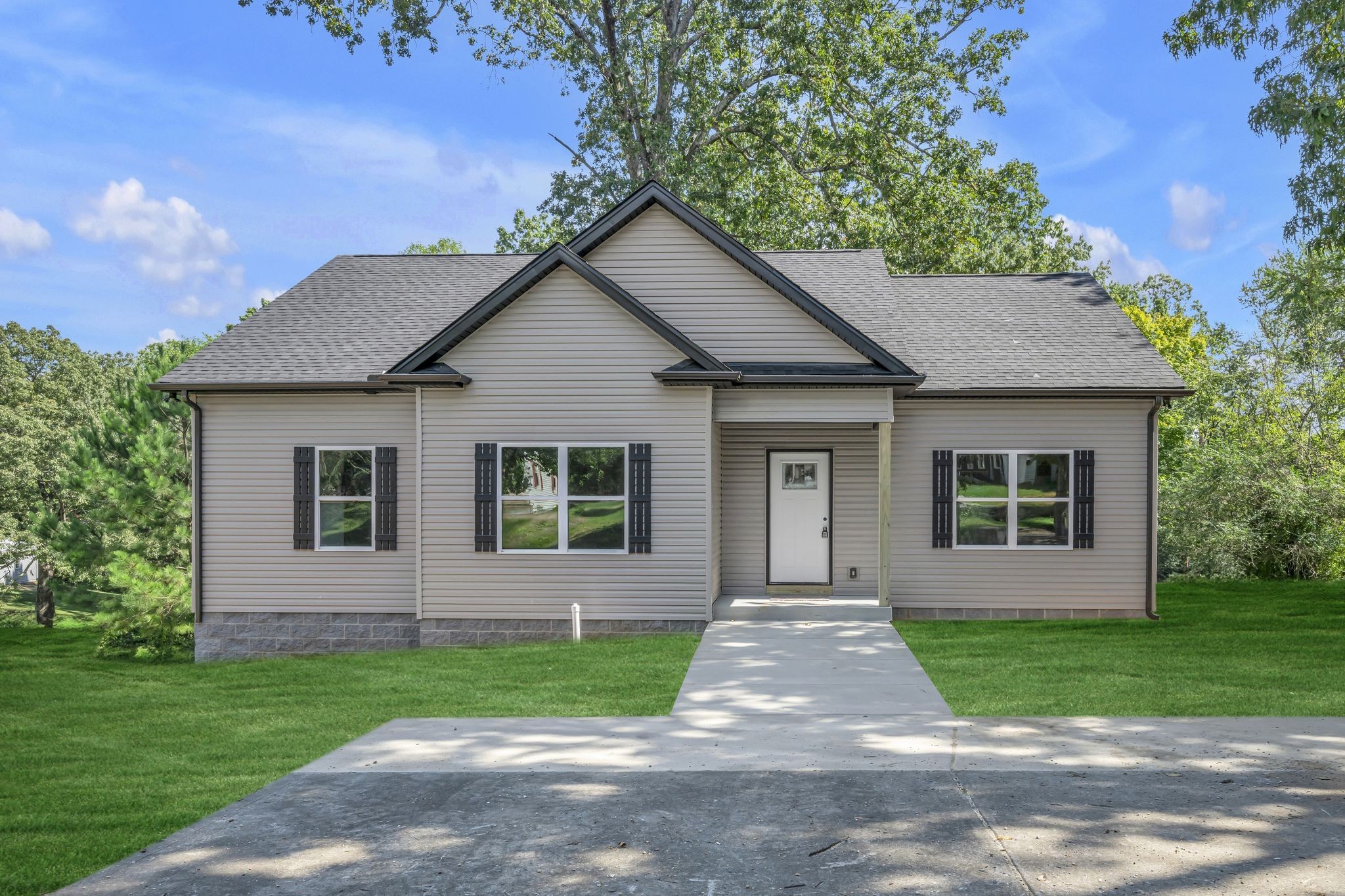 front view of a house and a yard