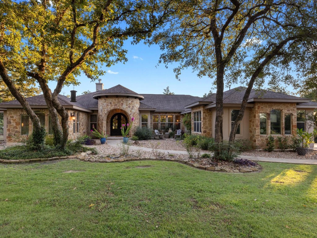 a front view of a house with garden