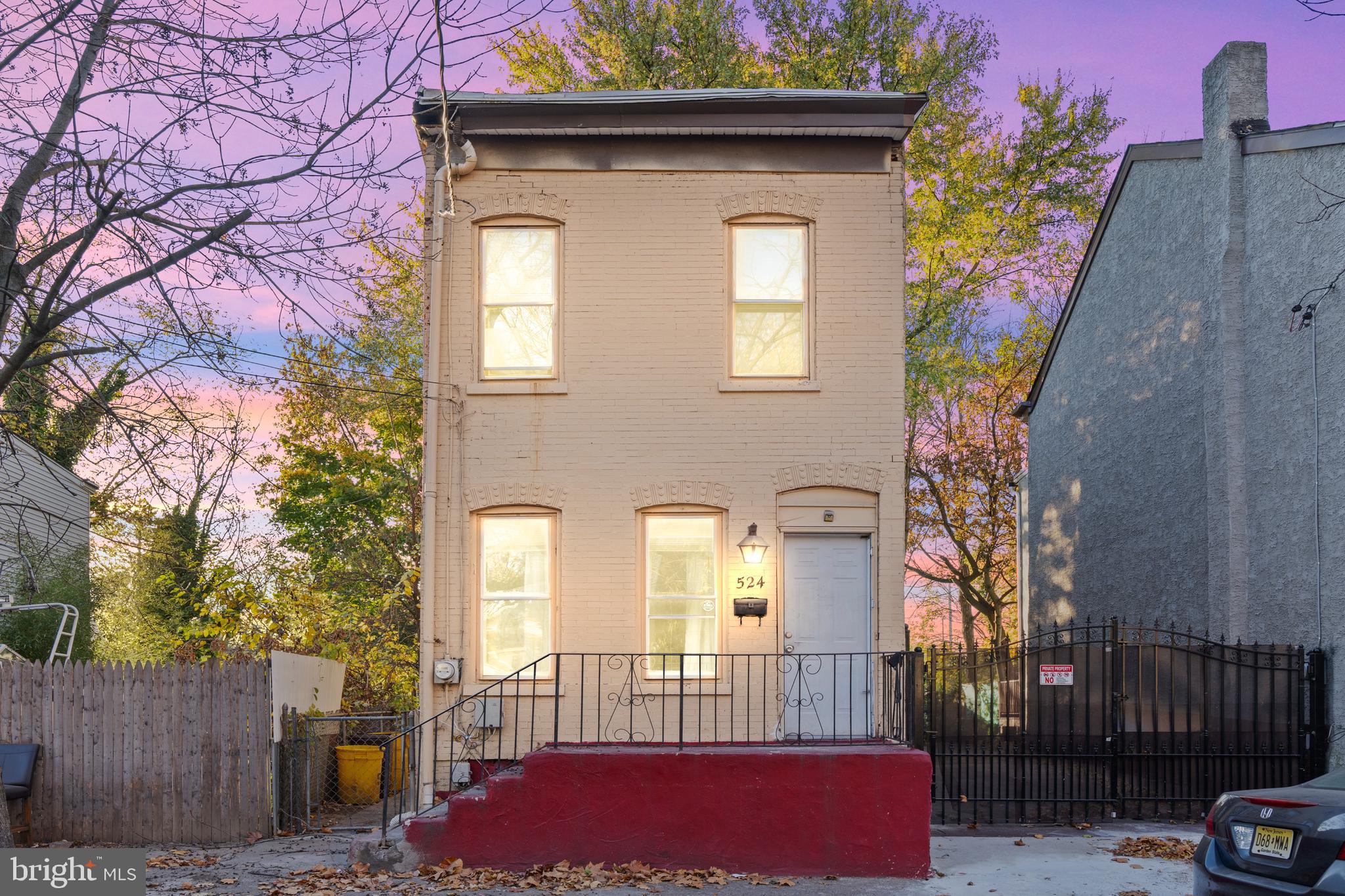 a front view of a house with parking