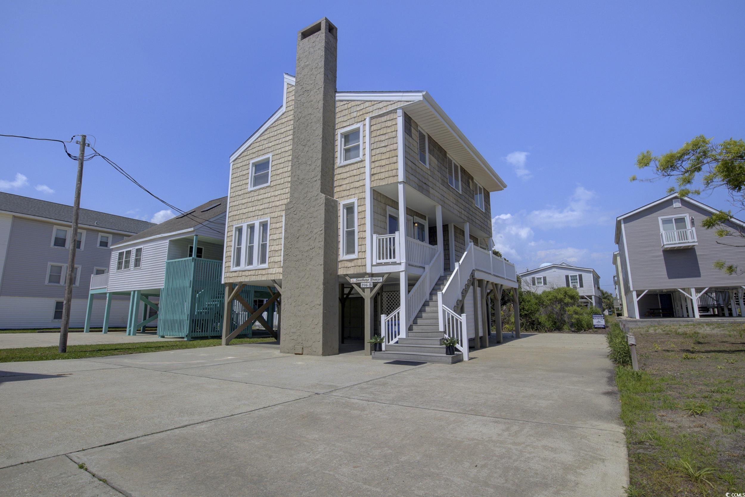 View of side of property featuring a carport