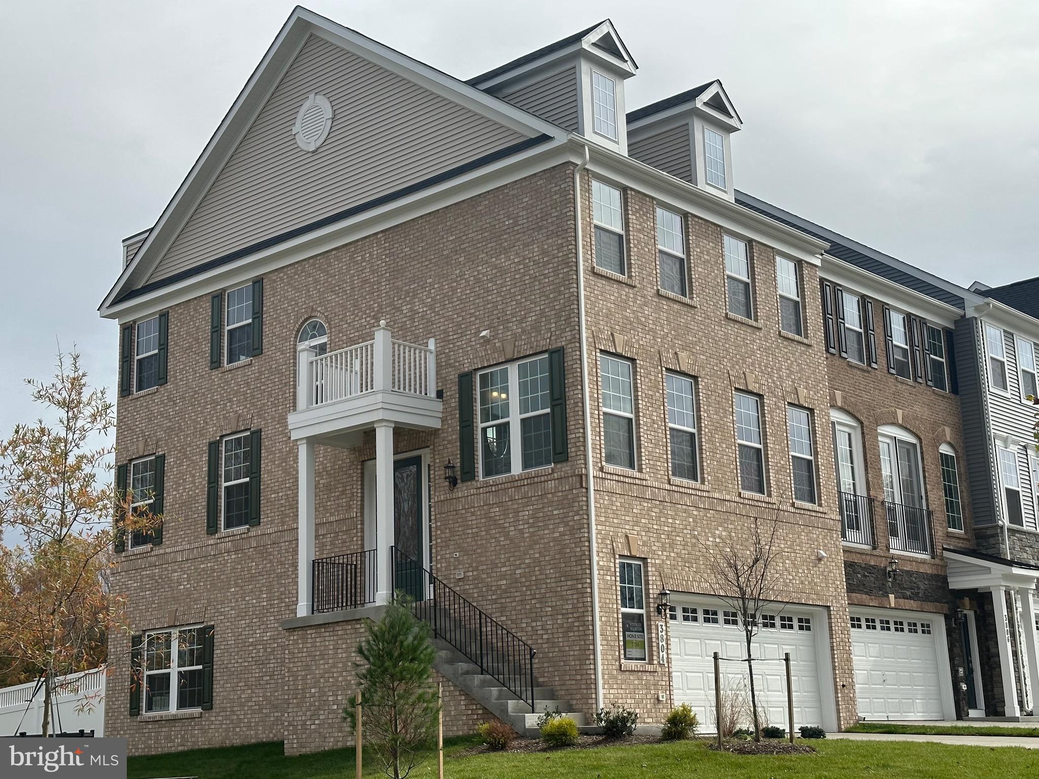 a front view of a building with a yard