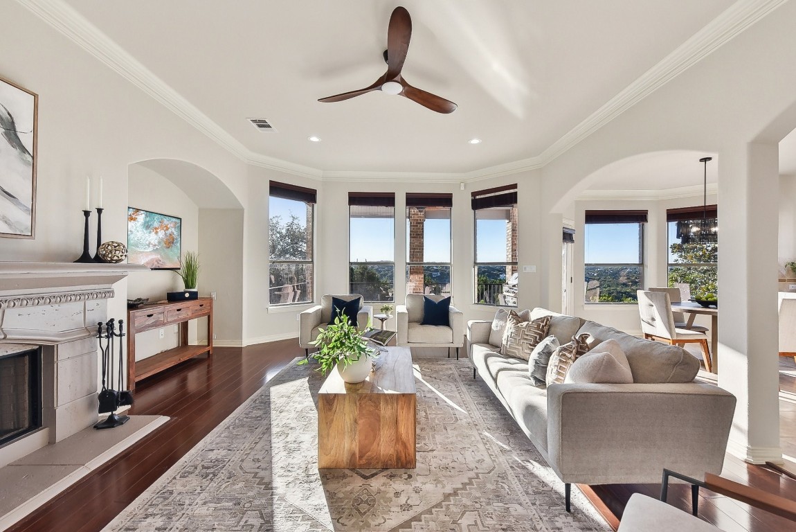 a living room with furniture and a fireplace