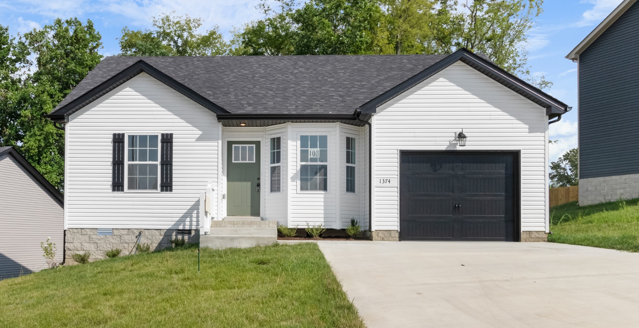 a view of house with yard