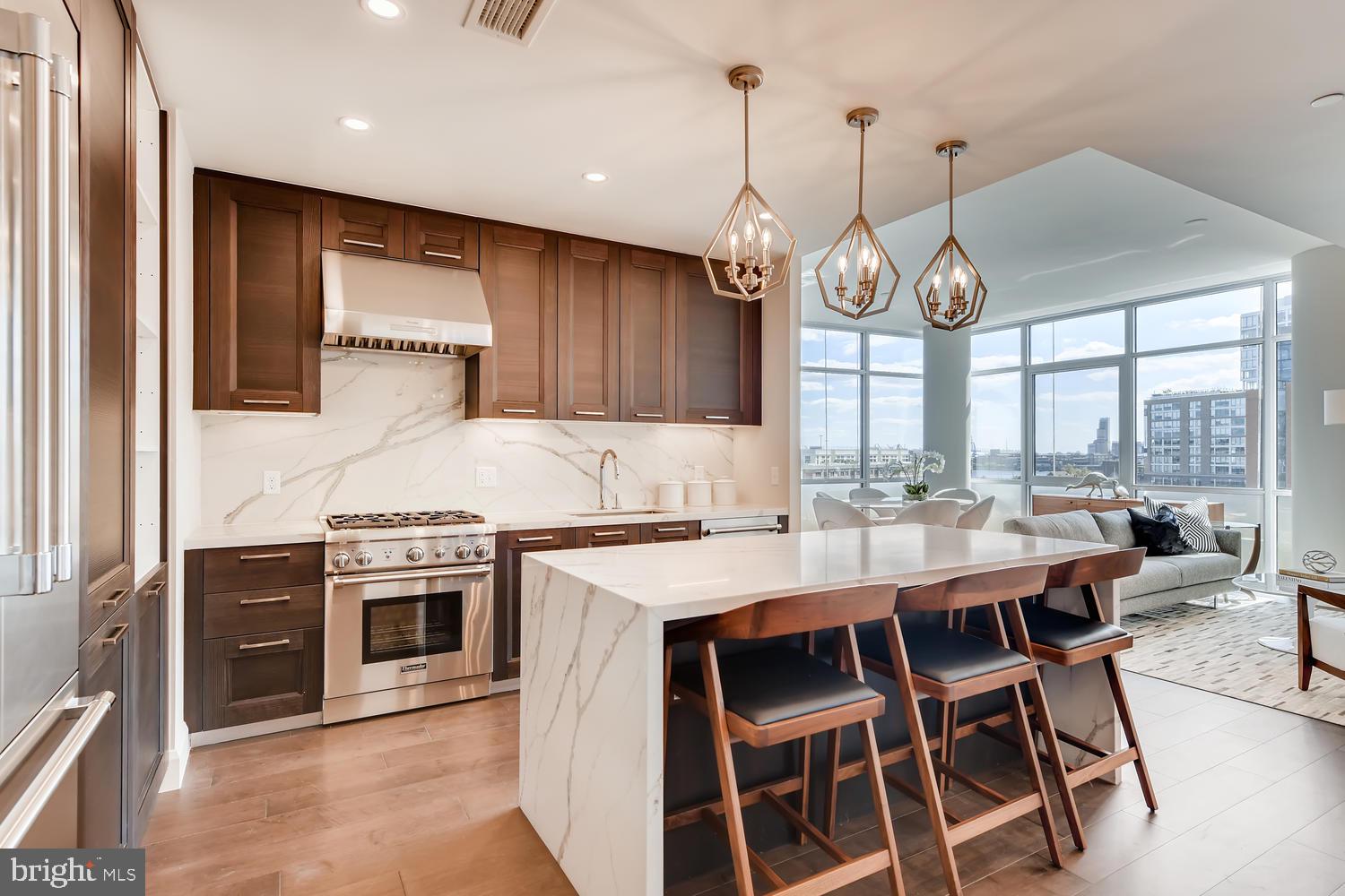 a large kitchen with a table and chairs in it