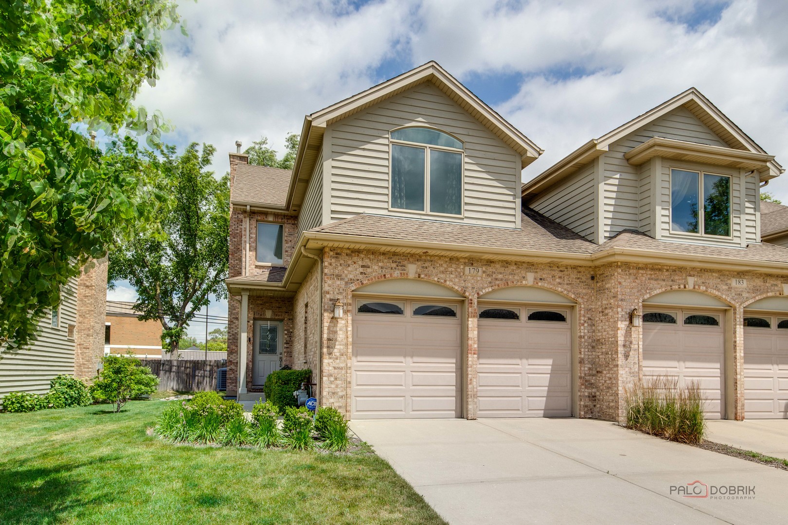 front view of a house with a yard