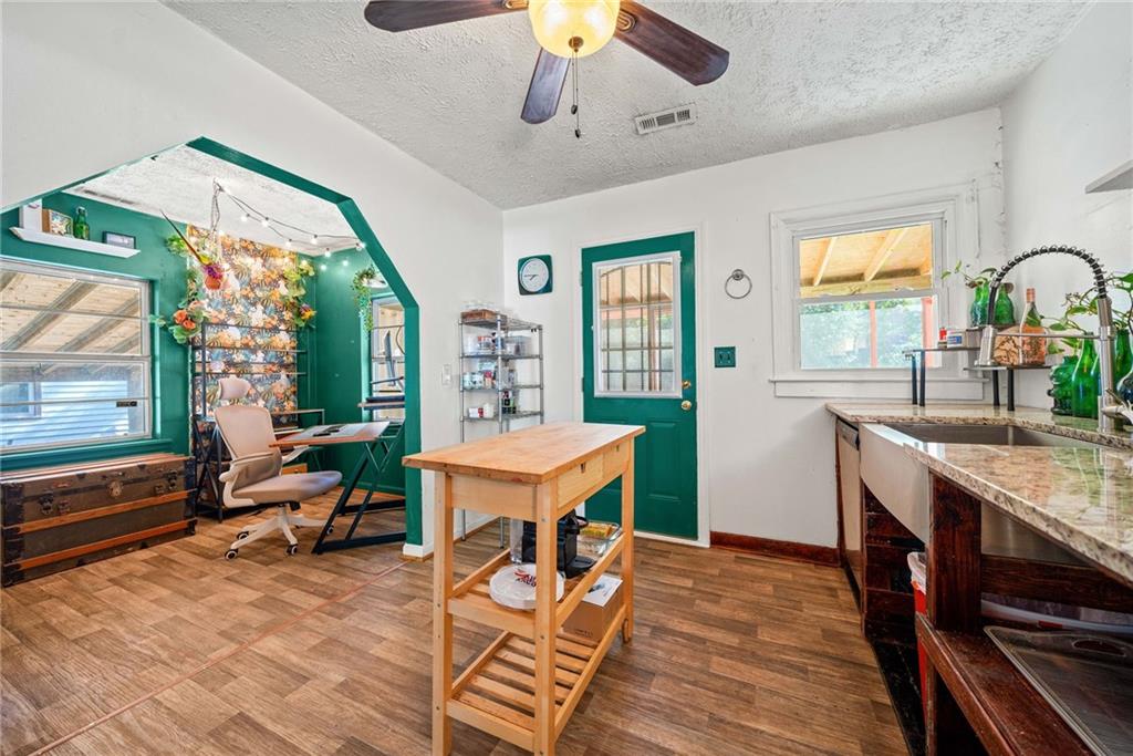 a view of a livingroom with furniture window and wooden floor