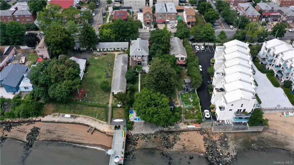 an aerial view of a house with a yard and garden