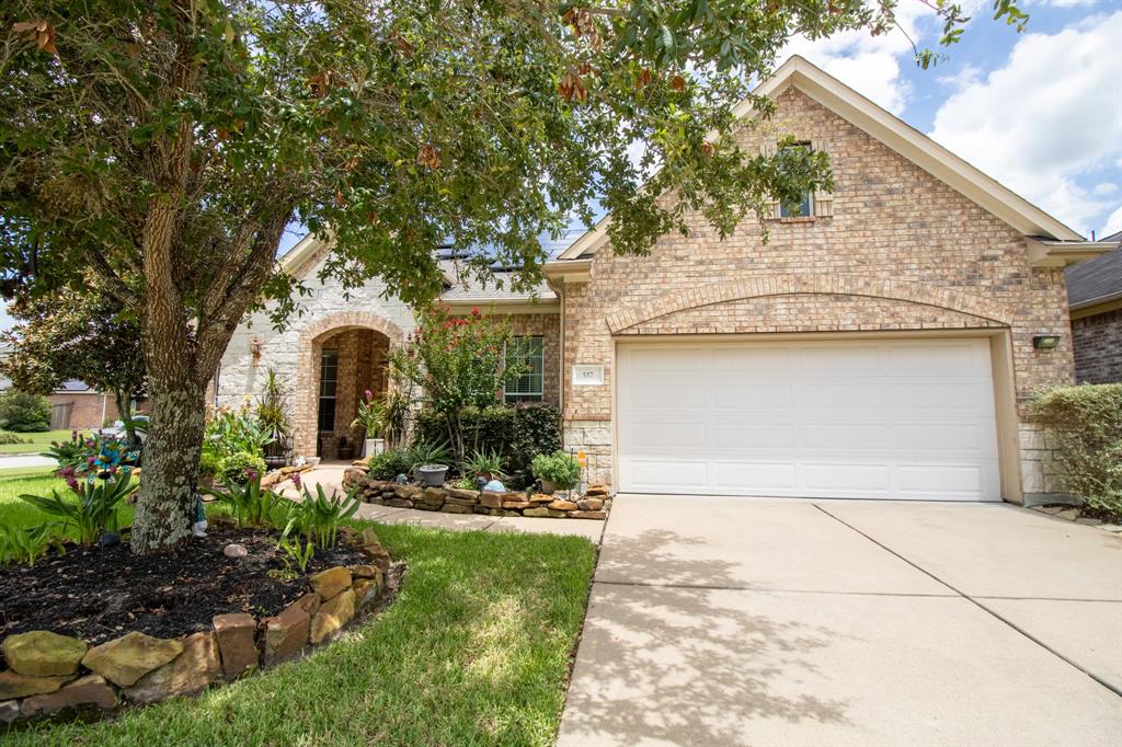 Welcome Home to this beautiful brick and stone exterior home