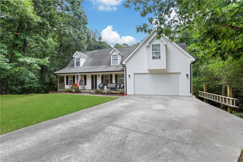 a front view of house with yard and green space