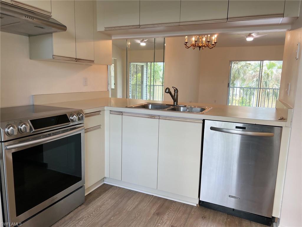 a kitchen with a stove and a microwave