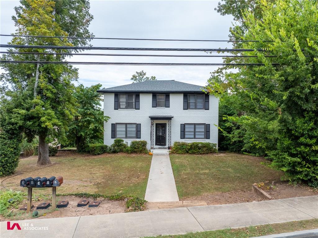 a view of house with yard