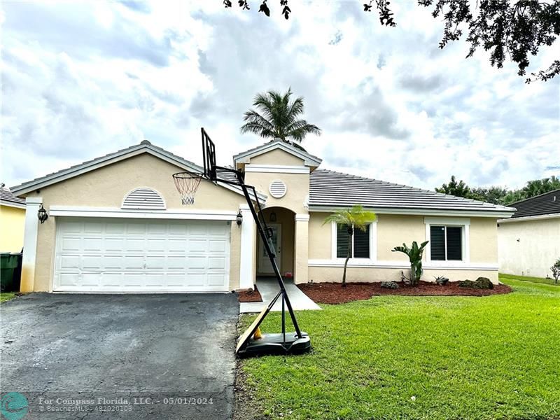 a view of front a house with a yard