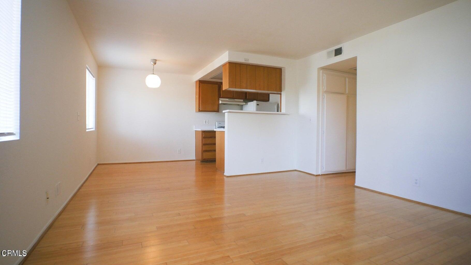 a view of a kitchen with a sink and a window