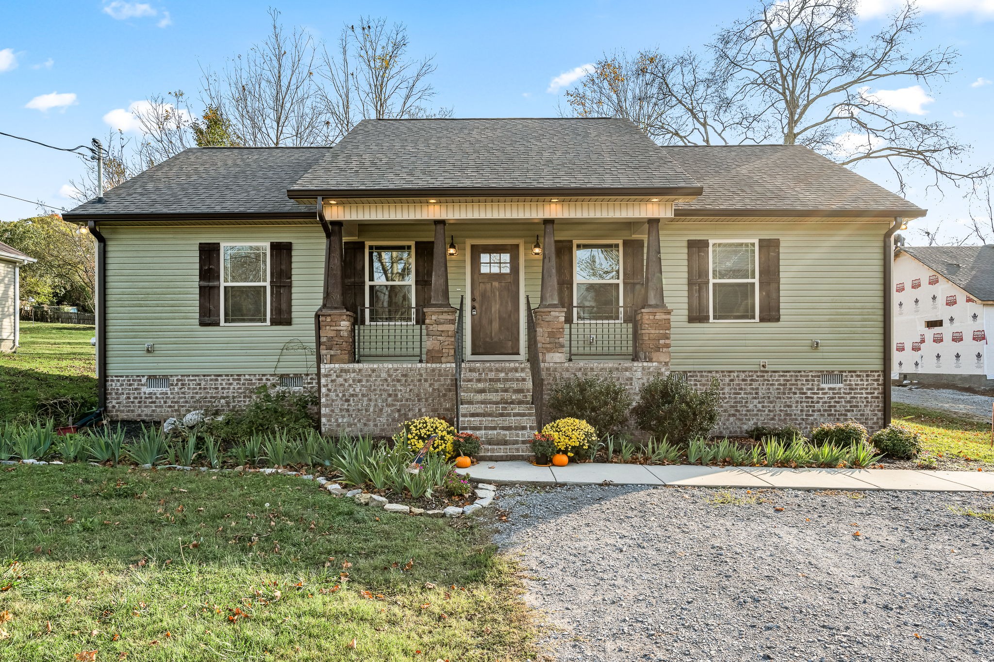 a front view of a house with garden