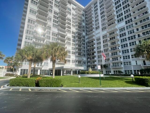 a view of a building with a yard