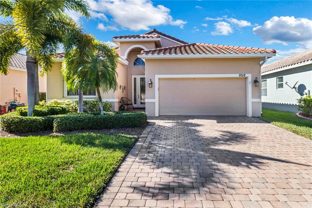 Mediterranean / spanish-style house featuring a garage