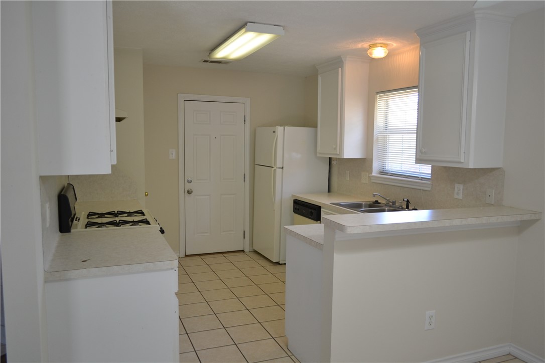 a utility room with washer and dryer