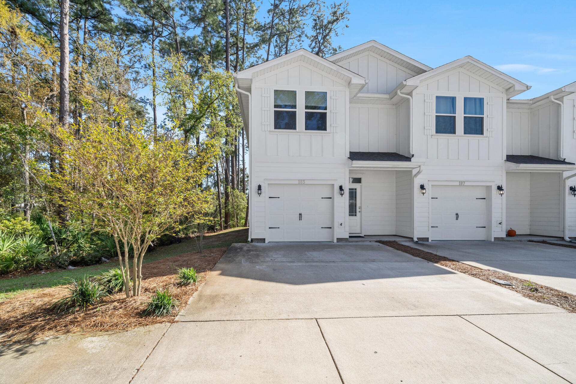 a front view of a house with a garage