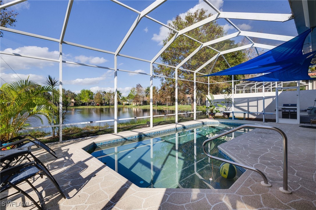 a view of a backyard with a table and chairs under an umbrella