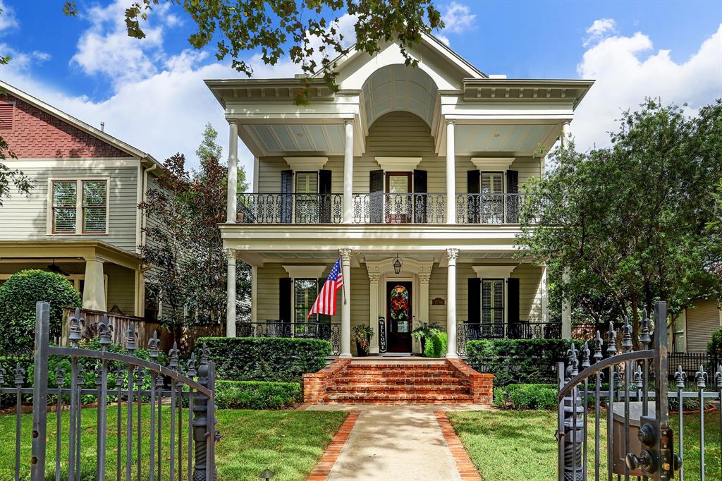 Stunning Home on Arlington Street, one of the most premier streets in the Houston Heights, featuring extensive front yard, fully gated, and expansive front porch and upstairs Balcony, with access from the Primary Suite.