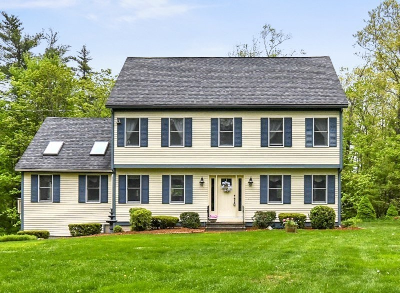 a front view of a house with a yard