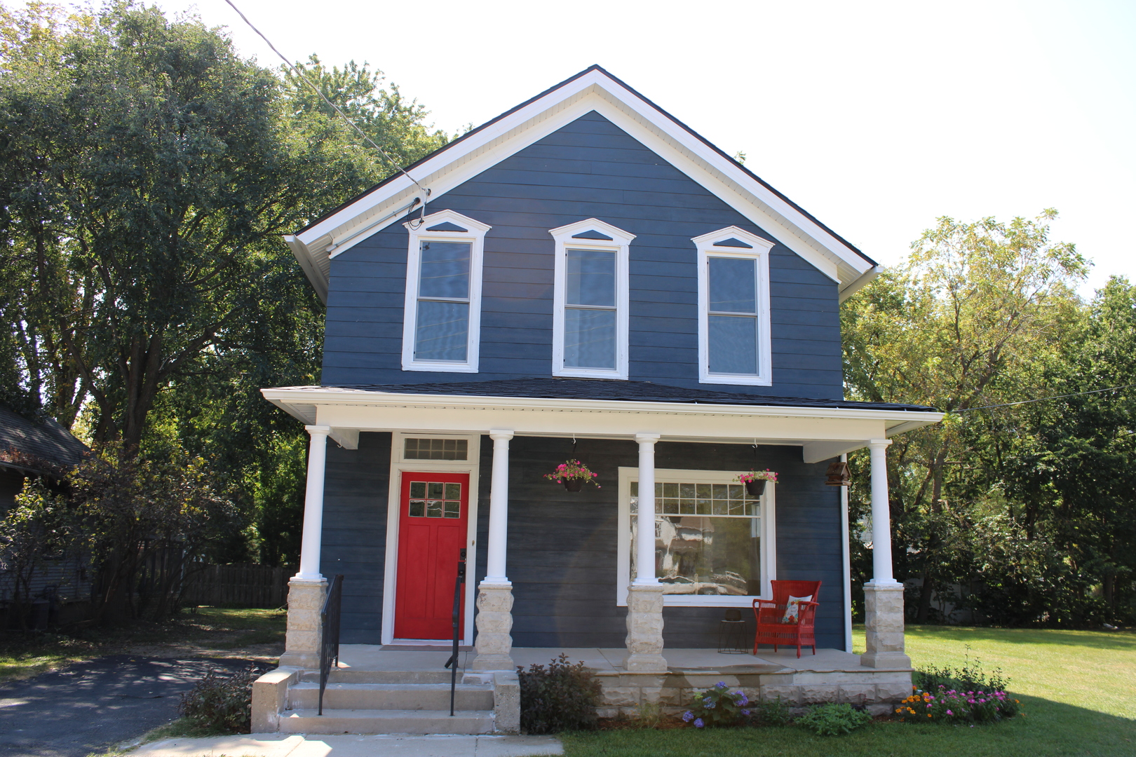 a front view of a house with garden