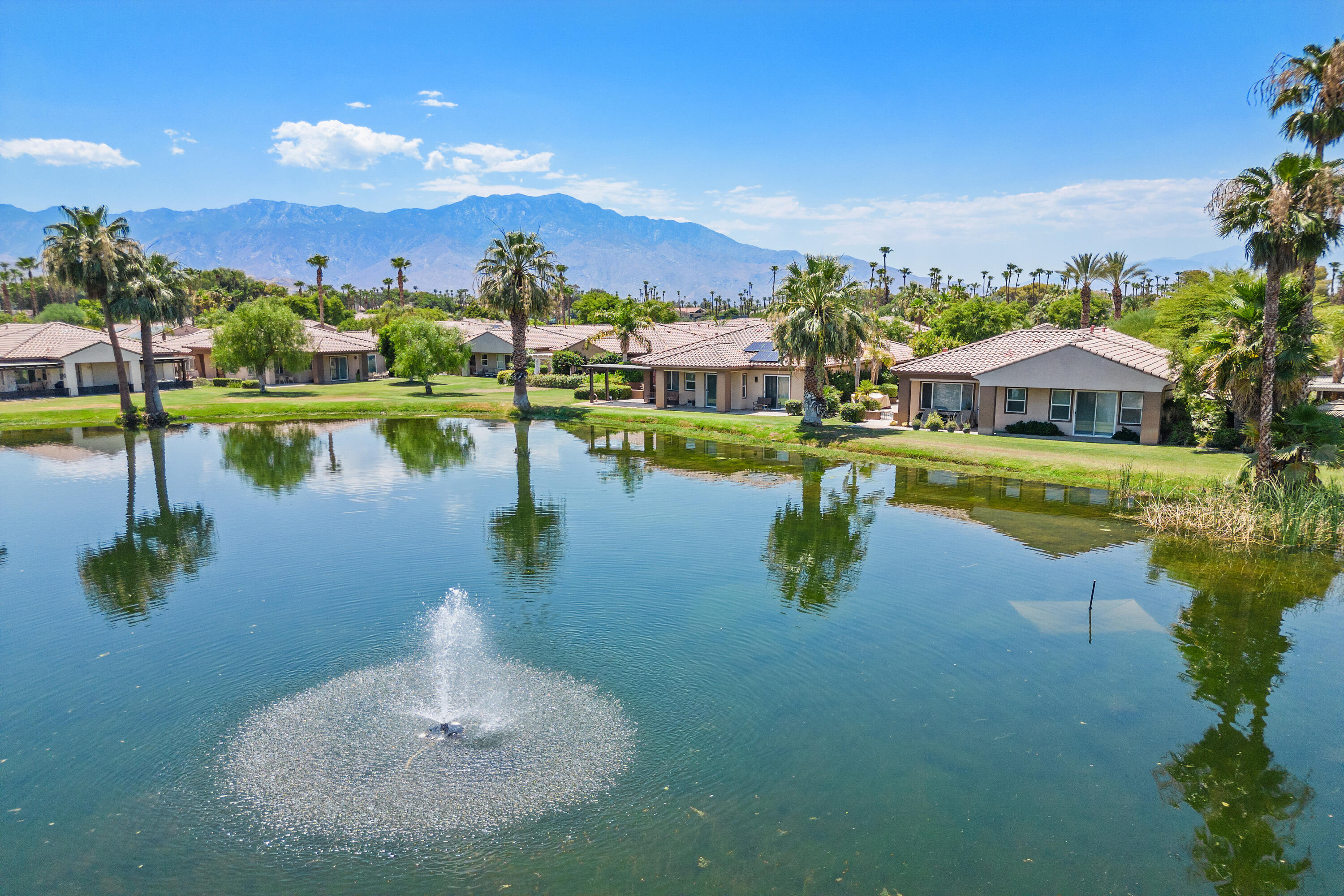 a view of a lake with a house in the background