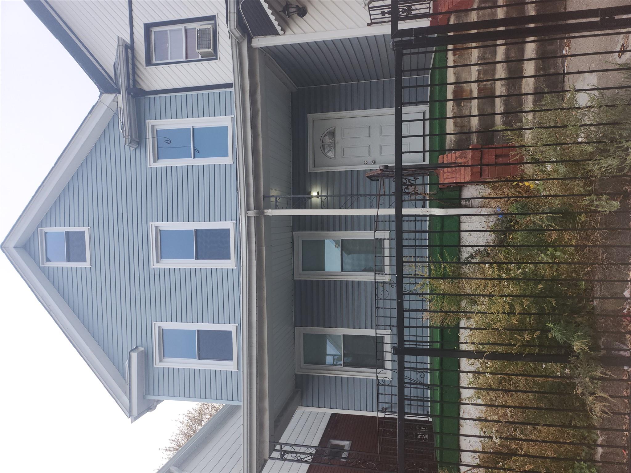 a front view of a house with glass windows