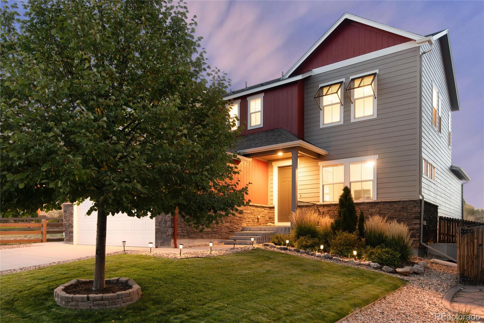 a front view of a house with a yard