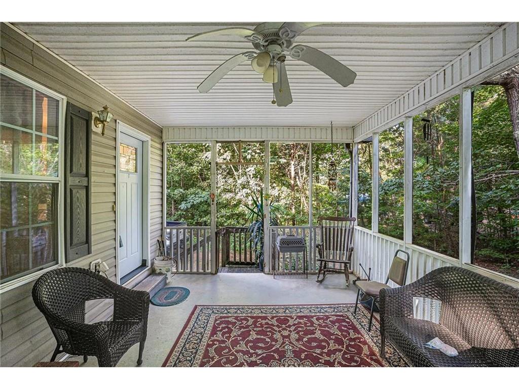 a balcony with furniture and wooden deck