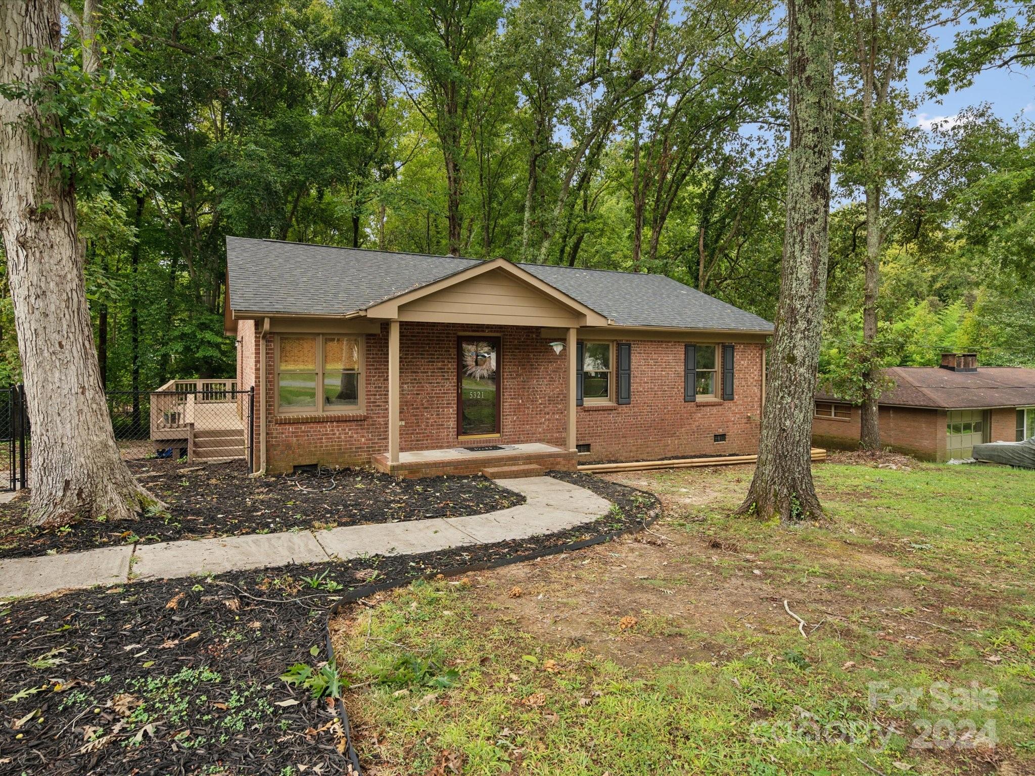 a house with trees in the background