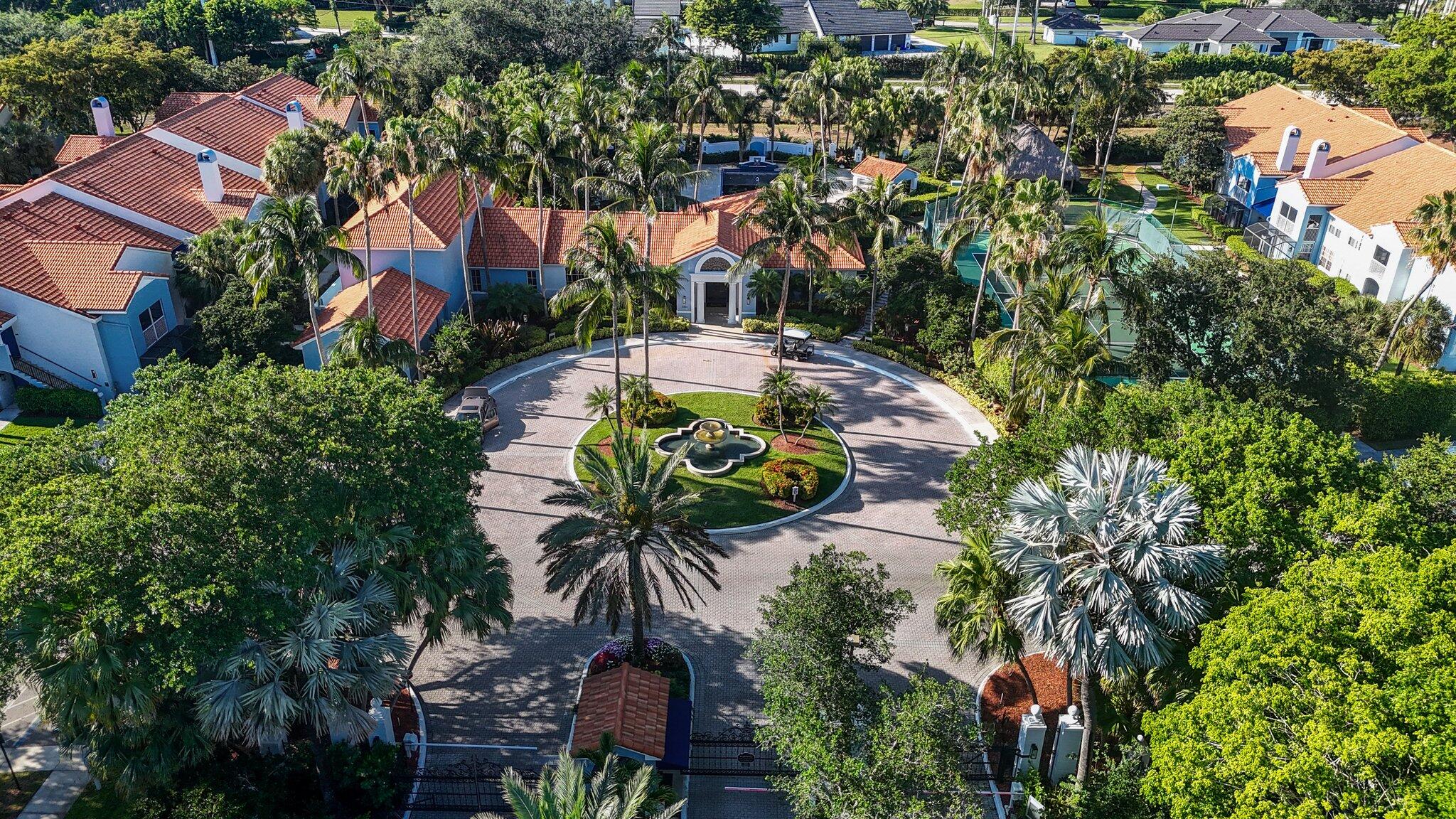 an aerial view of multiple houses with yard