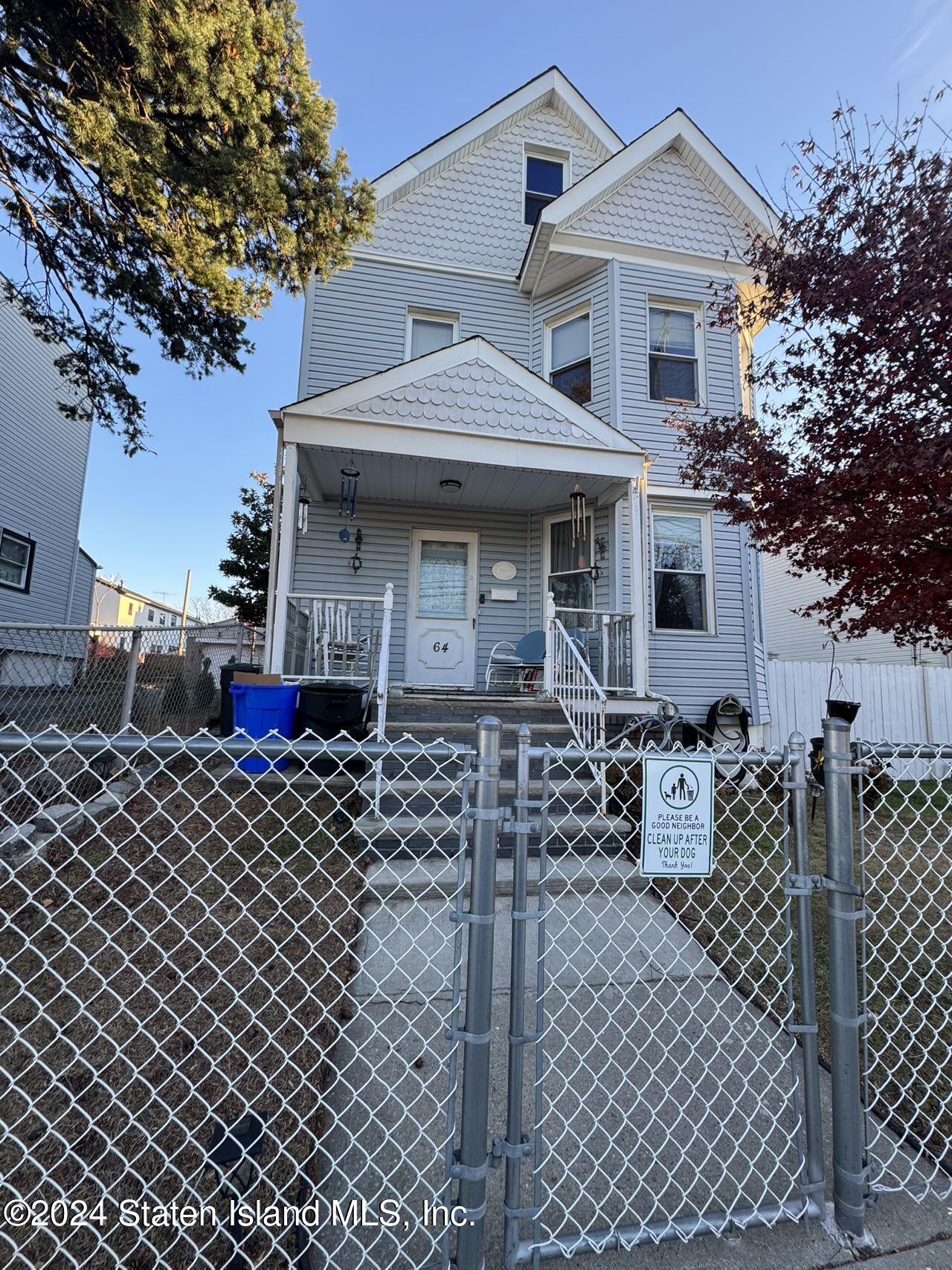 a front view of a house with a large window