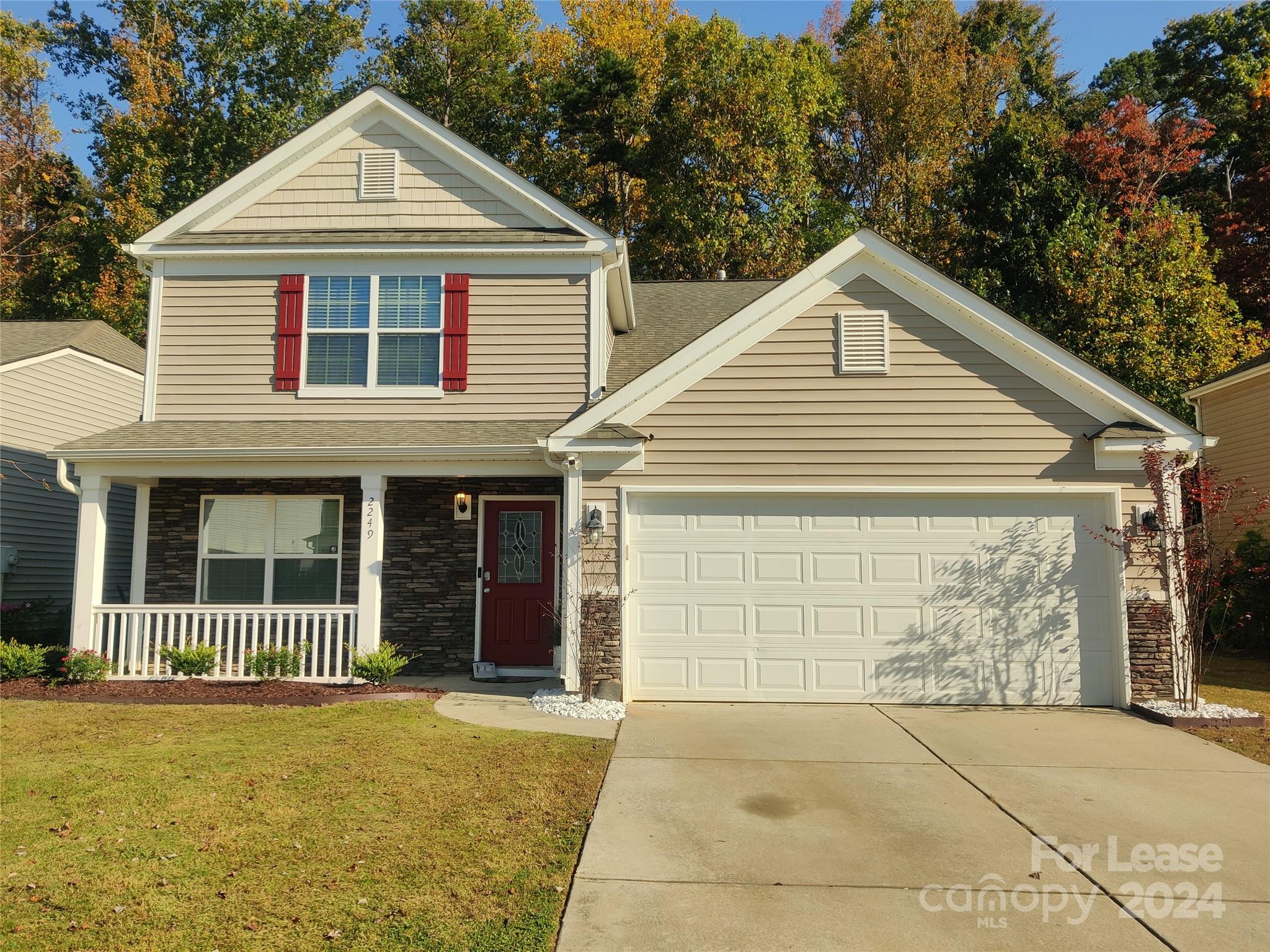 a front view of a house with a garage