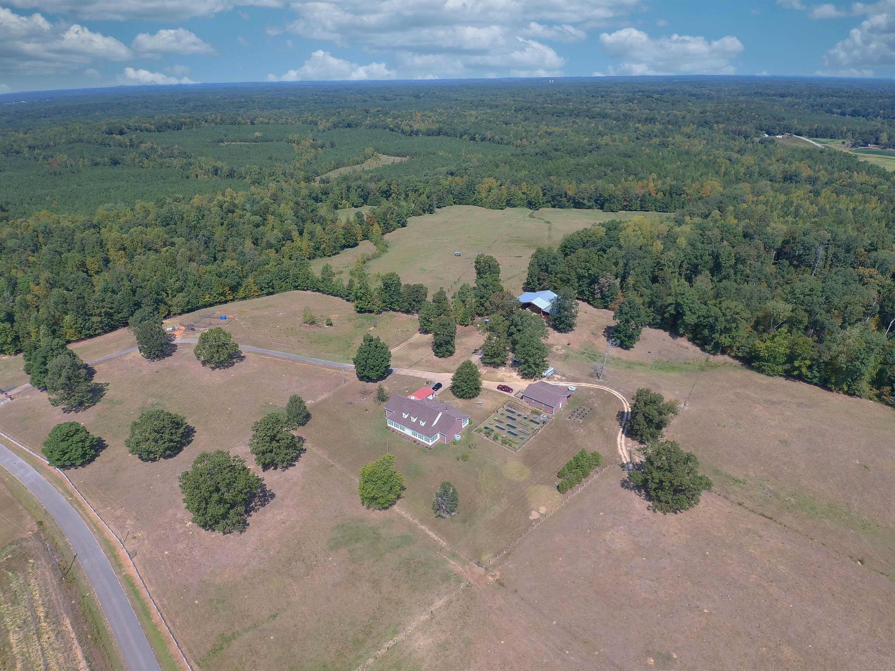 an aerial view of a house with yard