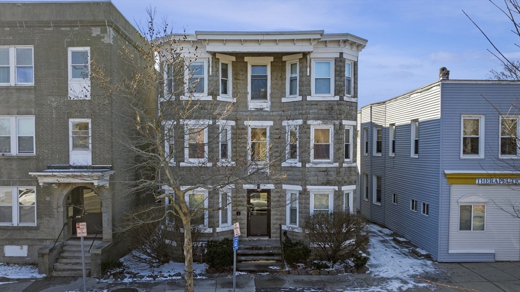 a front view of a building with glass windows