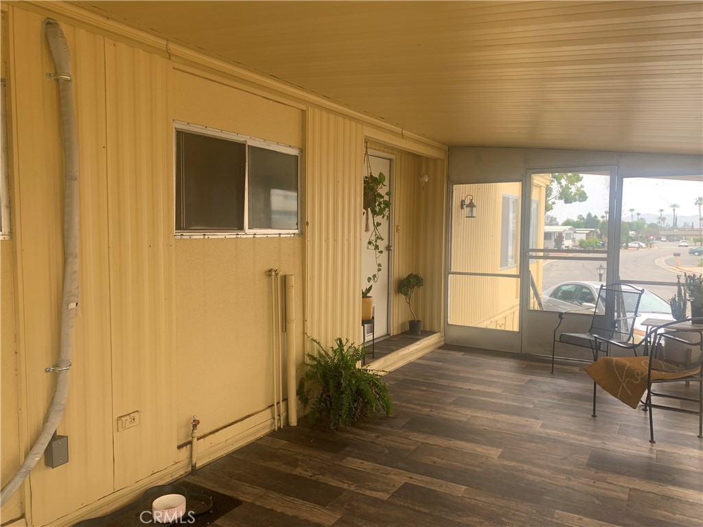 a living room with furniture window and wooden floor