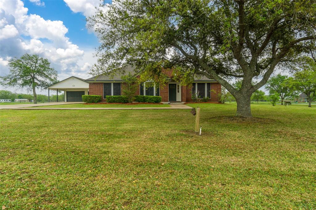 Sitting on just over 2 acres of land! Extended driveway leading to a two car garage.