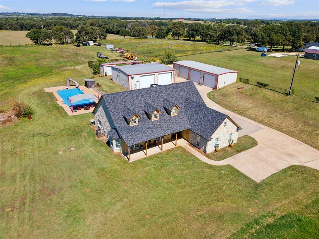 an aerial view of a house with outdoor space