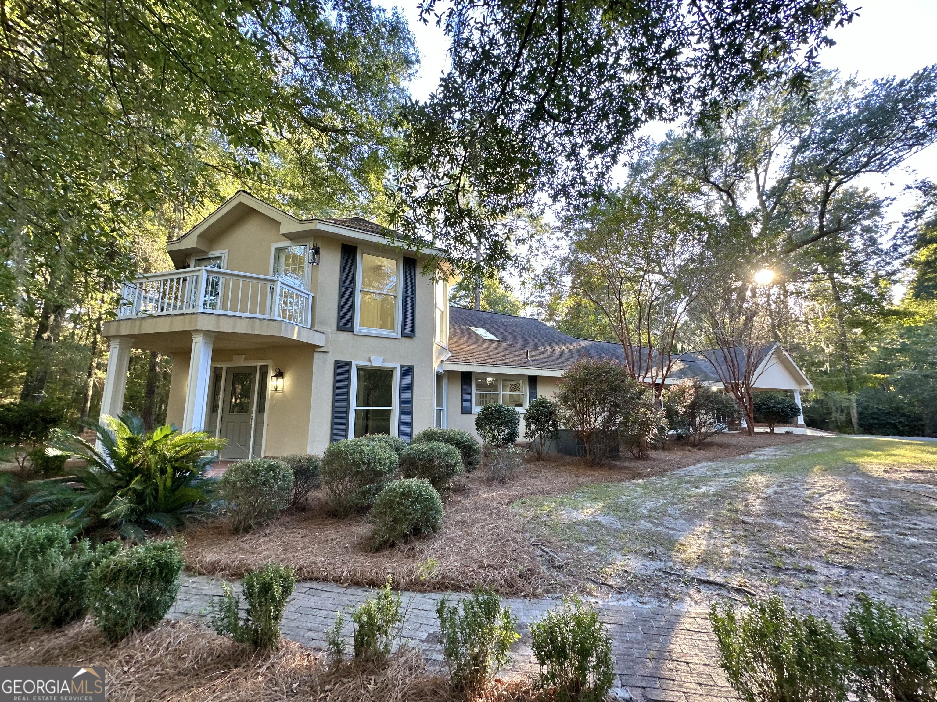 a front view of a house with garden