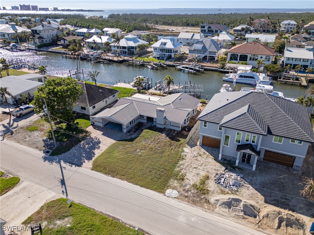 an aerial view of a residential houses with outdoor space