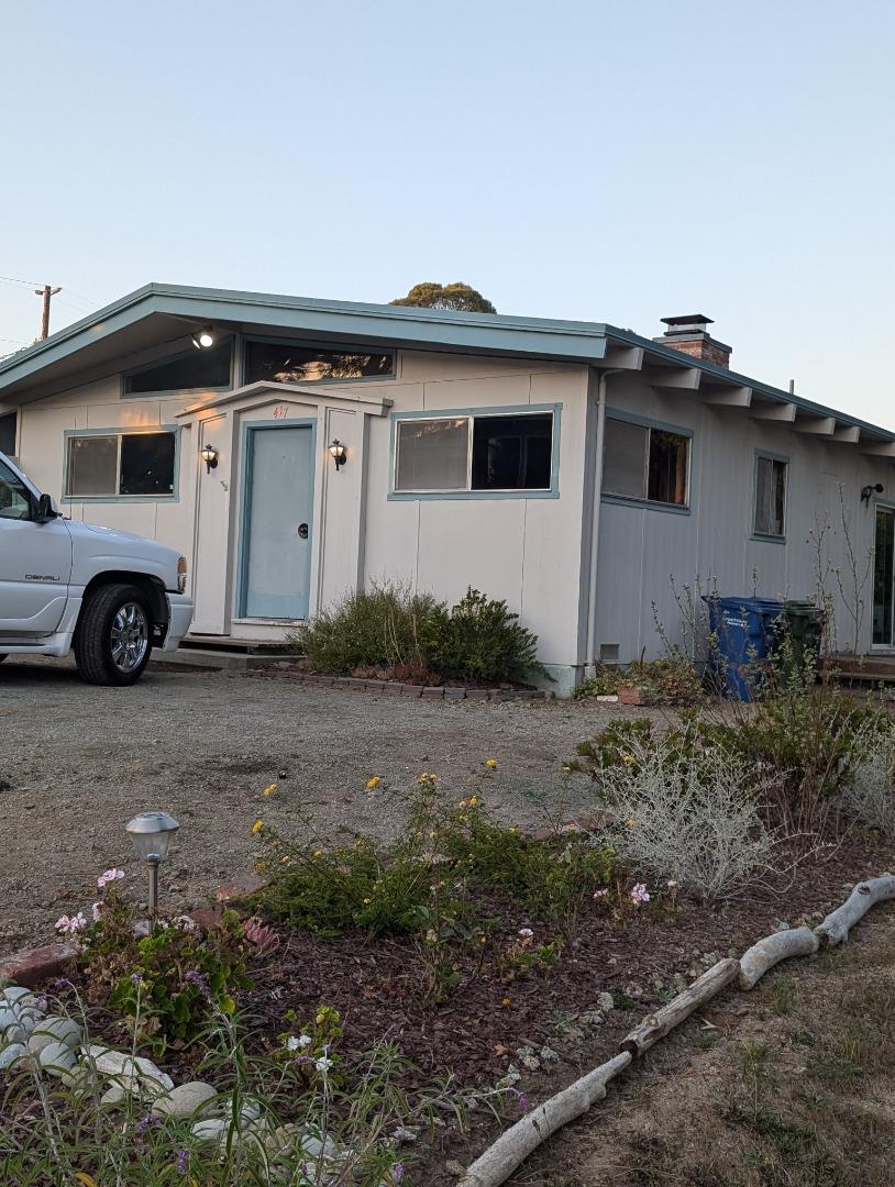 a view of a car in front of a house