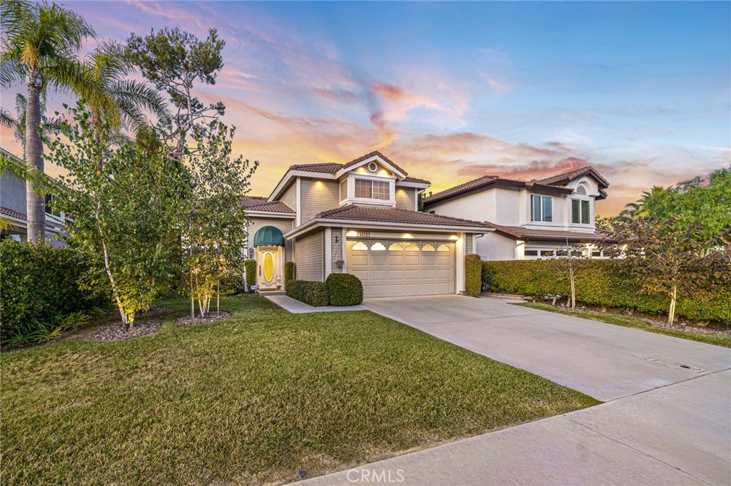 front view of a house with a yard