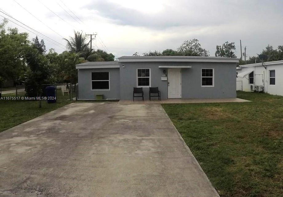 a view of a house with a backyard space